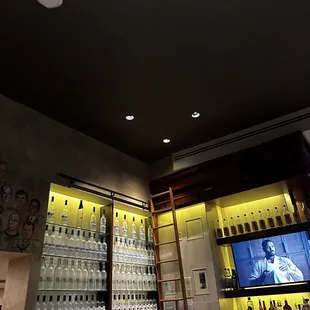 a bar with bottles of alcohol