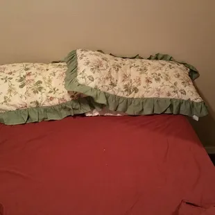 No headboard, no nightstands, no lamps, weird sheets