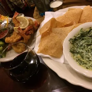 Spinach artichoke dip and the fried shrimp dinner with a nice glass of wine.
