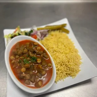 a plate of food and a bowl of rice