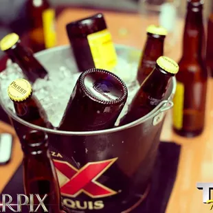 a bucket of beer bottles