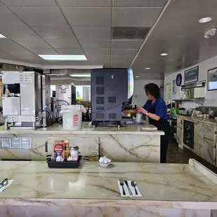 a woman preparing food in the pancake house