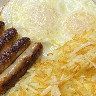 Perfectly fried eggs, hash browns and delicious sausage