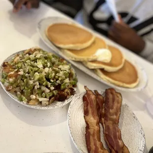 Pancakes, hash browns and bacon