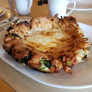 Garden surprise! Lots of veggies and cheese, ordered a poached egg on the side bc it seemed like the right thing to do. Can confirm, it was.