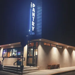 the exterior of the restaurant at night