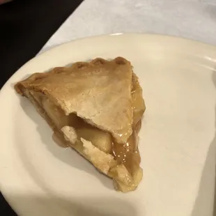 a slice of apple pie on a plate