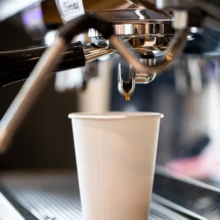 coffee being poured into a cup