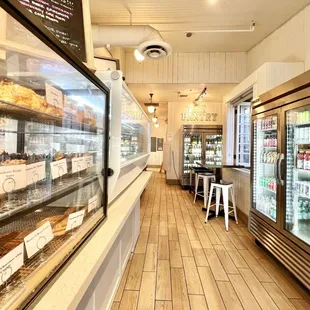 Pastry display case to the left, beverages to the right.
