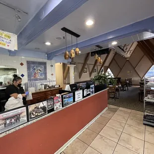 a woman standing at the counter