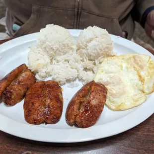 Longanisa with two over medium eggs and rice