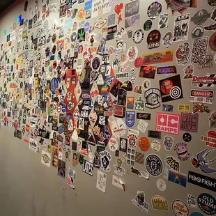 Wall of stickers by the restrooms