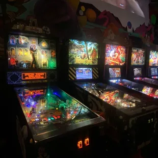 a row of pinball machines