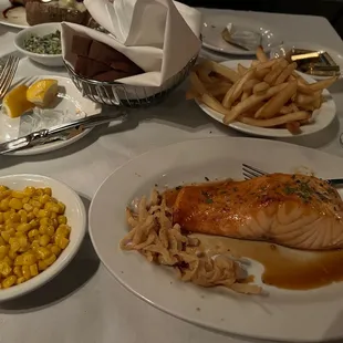 a plate of salmon and french fries