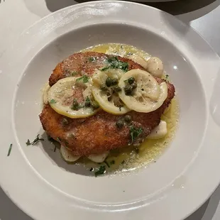 Chicken picatta and crispy chicken sandwich with truffle fries.