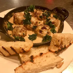 Cast Iron Skillet Served Beef Meatballs in a Mushroom Sauce with Focaccia Bread