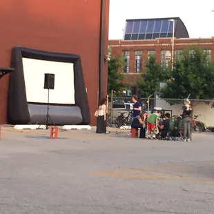 Setting up for outdoor movie in parking lot during Premiere