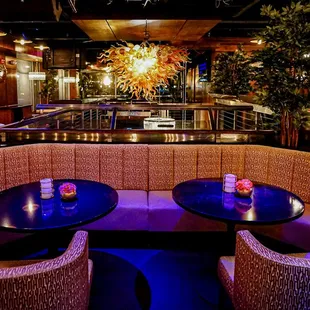 two tables and chairs in a restaurant