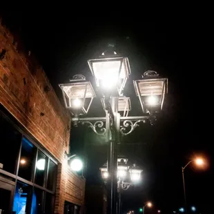 a row of street lamps lit up at night