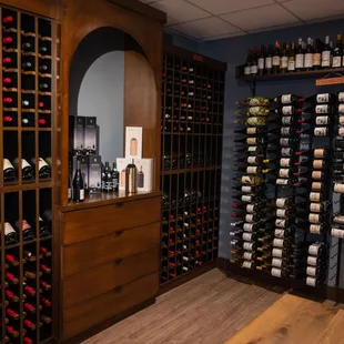 a wine cellar with many bottles of wine