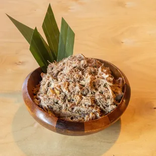 a wooden bowl of food