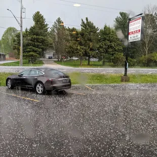 The Parkside Restaurant sign and an unlucky car in today&apos;s hail storm!