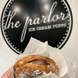 a hand holding a pastry