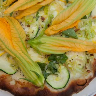 summer seasonal pizza with zucchini and squash blossoms