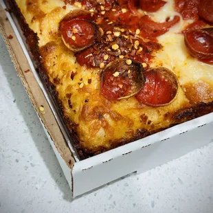 Nonna's Pizza Pie. Crushed red pepper added.