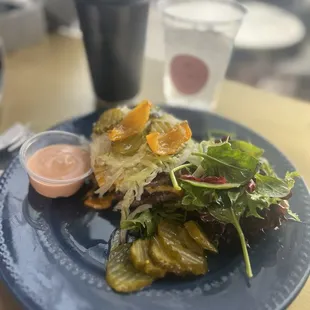 It's a Smash Burger - no bun, sauce on the side , accompanied with a side salad.