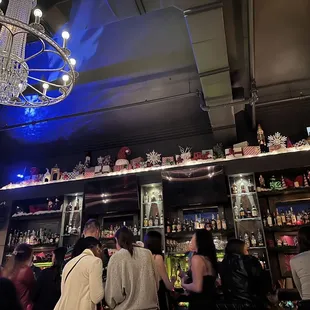 a crowd of people at a bar
