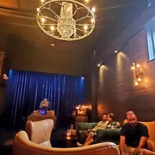 a group of people sitting around a bar