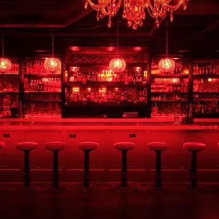 a bar with red lighting