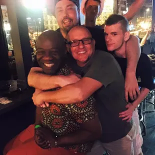 a group of men hugging each other