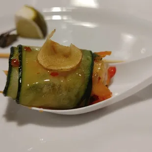 Hors d'oeuvres: Sesame Shrimp and Asian Vegetable cucumber roll with lotus root chip; served on Asian spoon