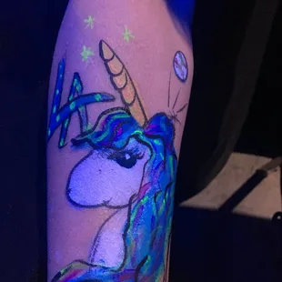 Glow-in-the-dark unicorn face paint