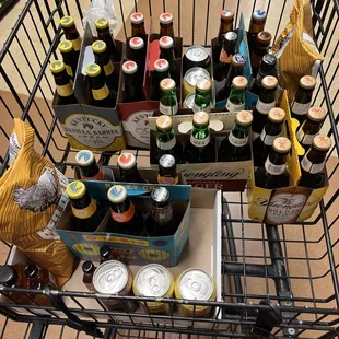 a shopping cart full of beer