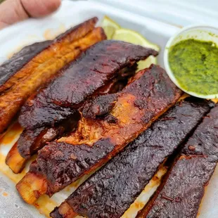 a plate of barbecued ribs