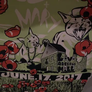 two dogs and a house in a field of poppies