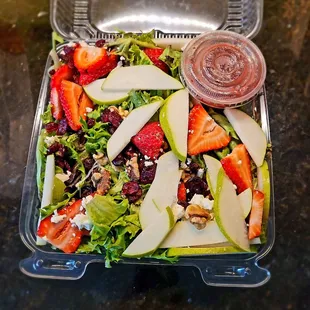 a salad in a plastic container