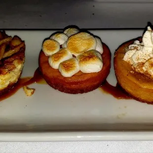 The dessert trio consisted of Apple Pie Cheesecake, Sweet Potatoe Pie &amp; Pumpkin Pie Cheesecake .. OMG we were in heaven!