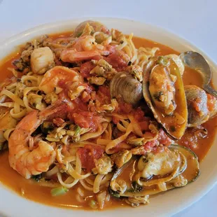 a plate of seafood and noodles