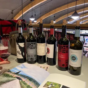 a table full of wine bottles