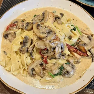 Tagliatelle &amp; Truffle Cream Sauce - chicken breast slices, mushrooms, spinach, sun-dried tomatoes