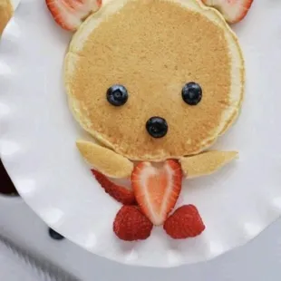 a plate with pancakes and strawberries