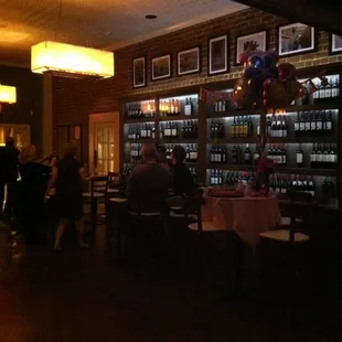 people sitting at tables in a restaurant