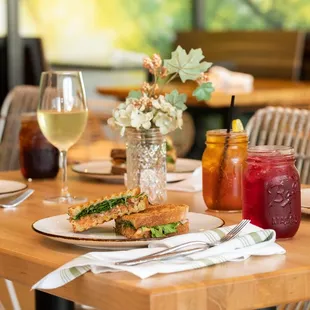 a table with sandwiches and drinks