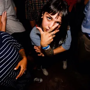 a woman with her hand on her face