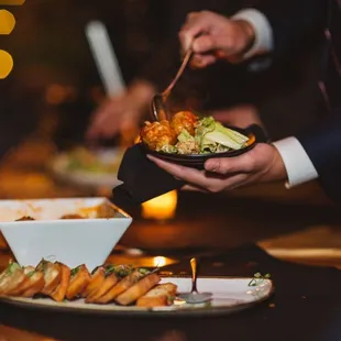 a person holding a plate of food