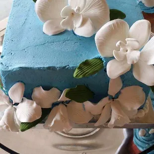 We had to reposition flowers and leaves to cover bumps from delivery.  A little humbug with all that blue and white flowers.